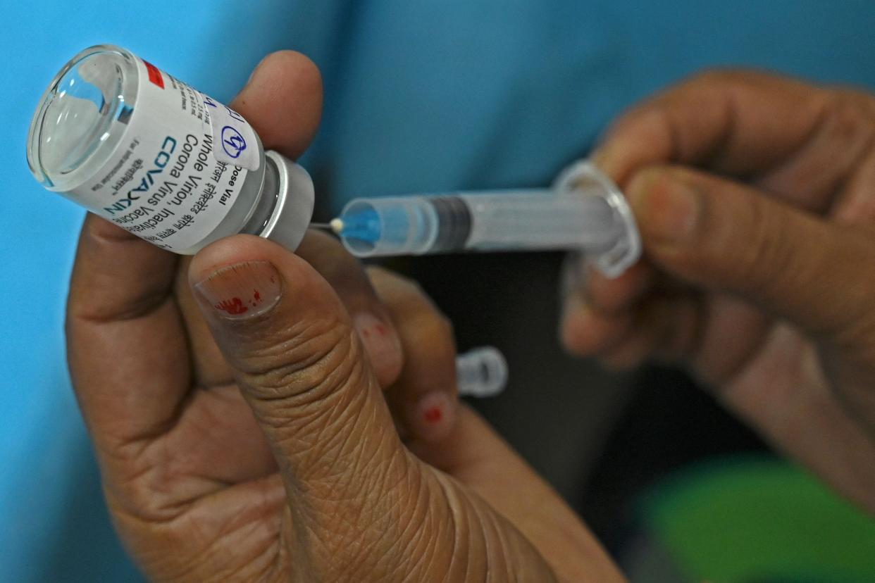 A medical worker prepares a jab of the Covaxin Covid-19 coronavirus vaccine, at a health center in New Delhi on April 29, 2021.