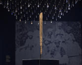 A machete used for cutting sugar cane is displayed at the Slavery exhibition Rijksmuseum in Amsterdam, Netherlands, Monday, May 17, 2021. The stark contrast between finery and brutality, wealth and inhumanity is a recurring pattern at the museum's unflinching new exhibition titled, simply, "Slavery", that examines the history of Dutch involvement in the international slave trade. (AP Photo/Peter Dejong)