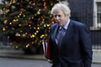 Britain's Prime Minister Boris Johnson walks across Downing Street to attend a cabinet meeting in London, Tuesday, Dec. 1, 2020. Members of Parliament will vote later Tuesday on the proposed tier system as the country prepares to come out of lockdown. (AP Photo/Kirsty Wigglesworth)