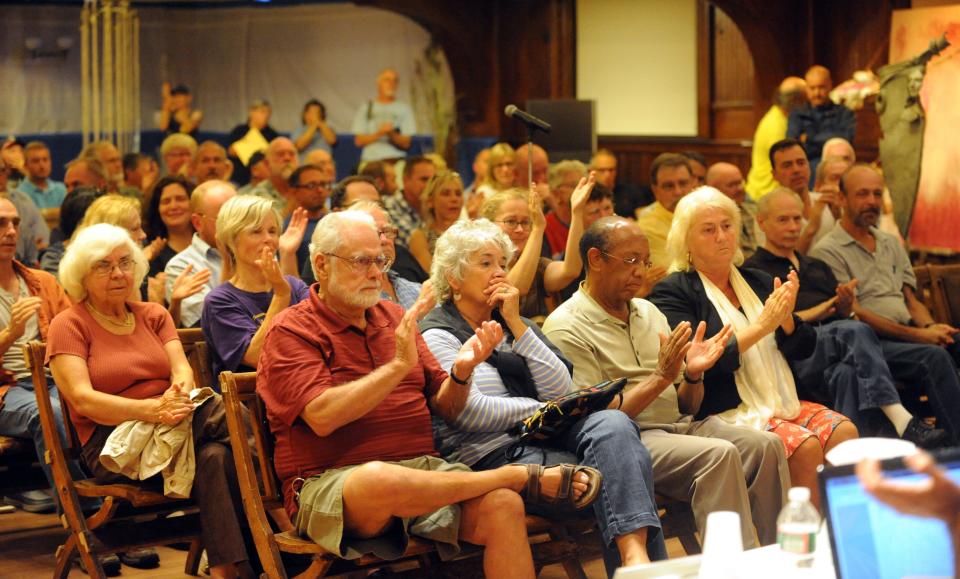 Duane Steele (center) and his wife Mary-Jo Avellar, at 2013 town meeting in Provincetown