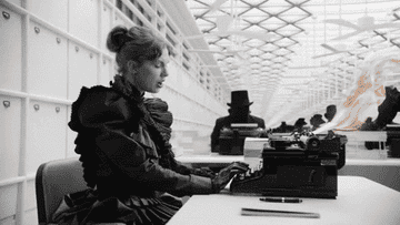 Taylor Swift typing on a typewriter in the "Fortnight" music video