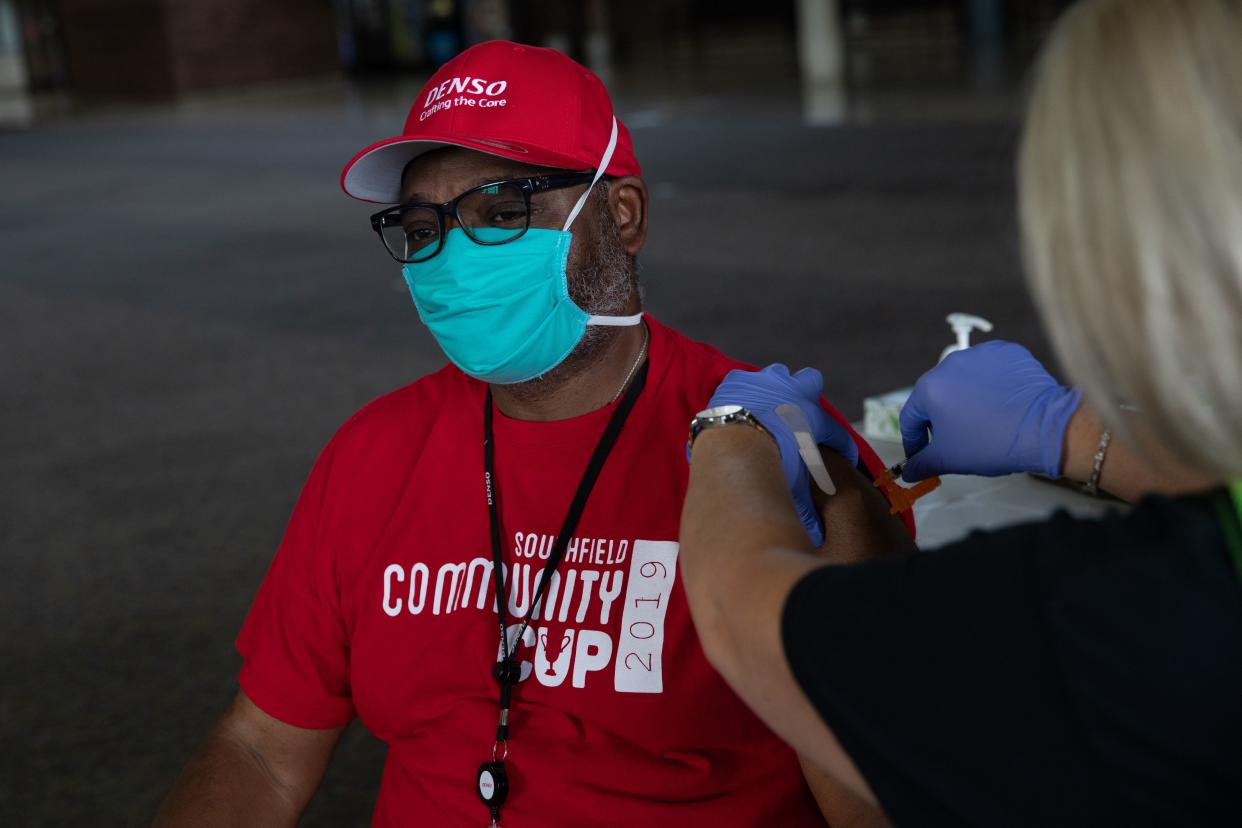 Anthony Faulkner receives his booster dose of the Moderna coronavirus (COVID-19) vaccine during an Oakland County Health Department vaccination clinic at the Southfield Pavilion on Aug. 24, 2021, in Southfield, Mich. Oakland County is the second county in Michigan to reach the state's goal of vaccinating 70% of its population.