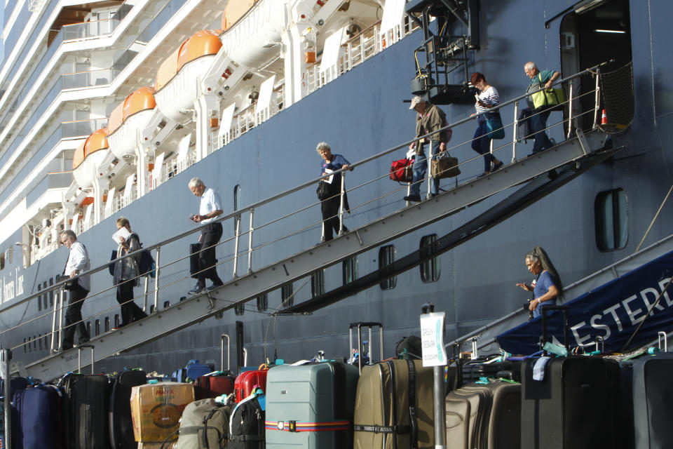 Passengers of the MS Westerdam disembark at the port of Sihanoukville in Cambodia. (AP Photo/Heng Sinith)