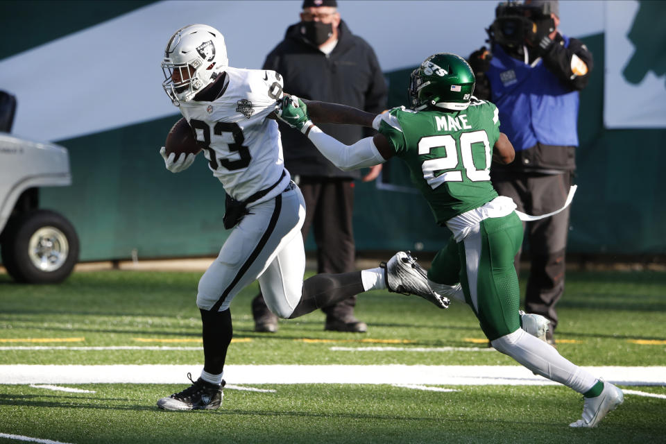 Las Vegas Raiders' Darren Waller, left gets past New York Jets' Marcus Maye for a touchdown during the first half an NFL football game, Sunday, Dec. 6, 2020, in East Rutherford, N.J. (AP Photo/Noah K. Murray)