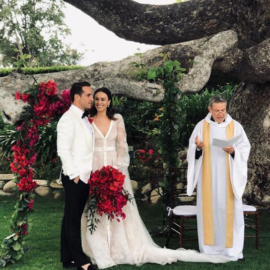 Australian actress Jessica McNamee married her fiancé, property developer Patrick Caruso, over the weekend - and we can't stop staring at her incredible belted wedding dress. Instagram/ilucygram