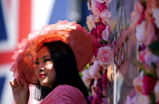 A racegoer at Royal Ascot at Ascot