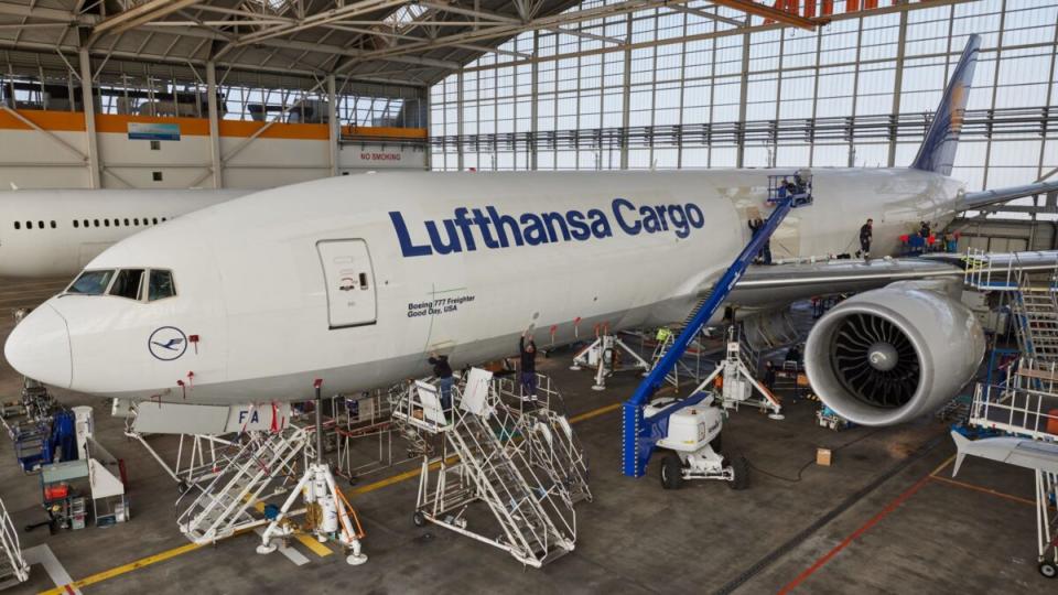 <em>Workers apply the AeroShark surface technology to a Lufthansa Cargo B777 freighter. (Photo: Lufthansa Cargo)</em>