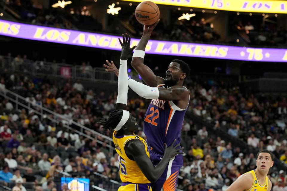 Phoenix Suns center Deandre Ayton (22) shoots over Los Angeles Lakers forward Wenyen Gabriel (35) during the first half of a preseason NBA basketball game Wednesday, Oct. 5, 2022, in Las Vegas. (AP Photo/John Locher)