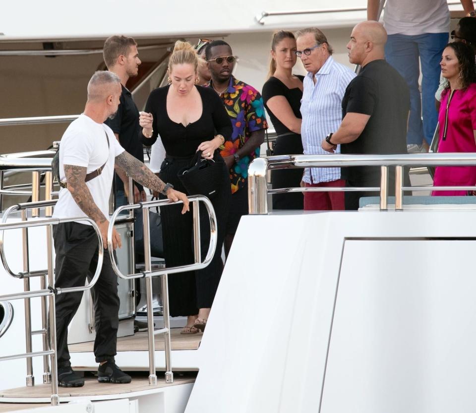 Sardinia, ITALY - Singer Adele looks in a good mood while seen with her boyfriend Rich Paul pictured enjoying their romantic holiday in Sardinia. The happy couple looked in good spirits while seen relaxing on a luxury yacht during their summer holiday in Sardinia, Adele looked casually fashionable in a black outfit with a matching Balenciaga handbag. Pictured: Adele, Rich Paul BACKGRID USA 23 JULY 2022 USA: +1 310 798 9111 / usasales@backgrid.com UK: +44 208 344 2007 / uksales@backgrid.com *UK Clients - Pictures Containing Children Please Pixelate Face Prior To Publication*