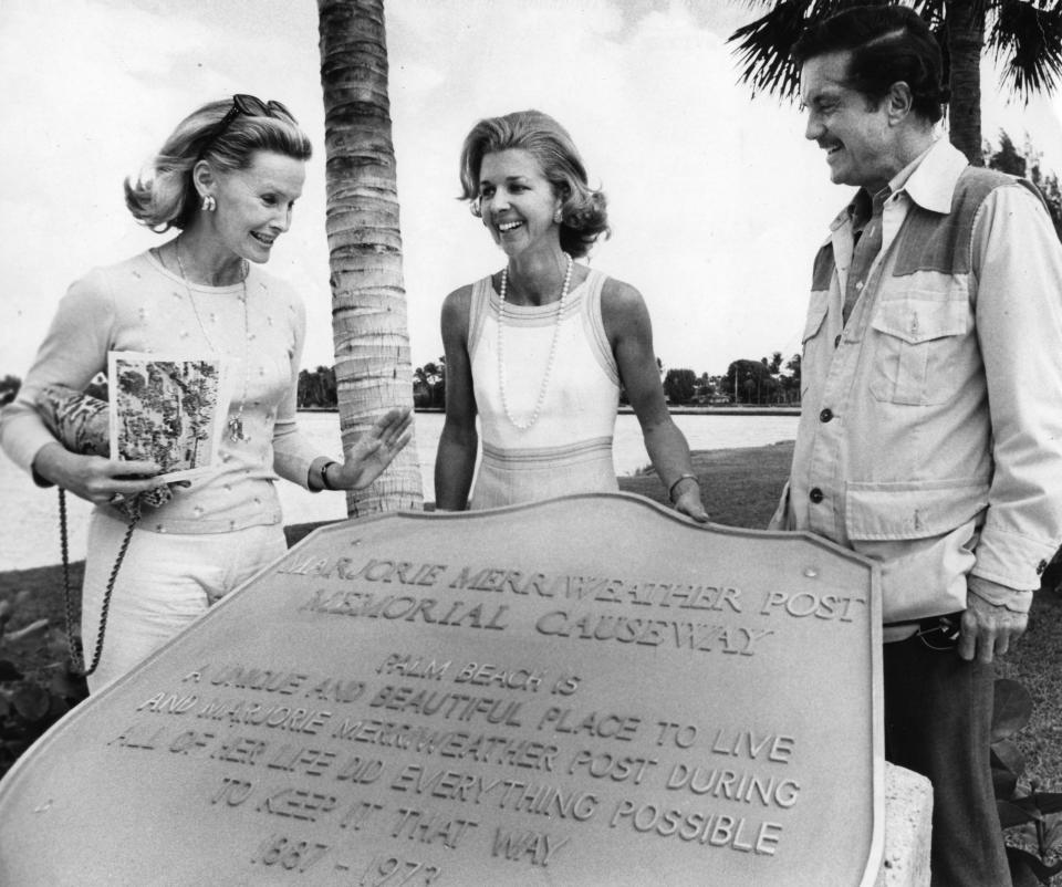 Marjorie Merriweather Post's daughter Dina Merrill, from left; Lesly Smith (standing in for her husband, Mayor Earl E.T. Smith; and actor Cliff Robertson (Merrill's husband at the time) at the dedication of the memorial in 1975, when the roadway was renamed in Post's honor.