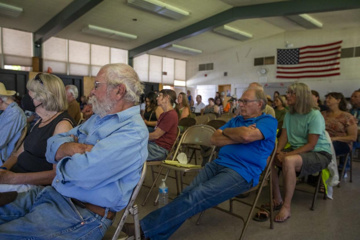 Residents attend a town hall meeting at the high school in Greenville.