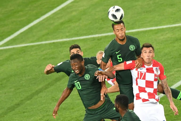 Nigeria's defender William Troost-Ekong heads the ball over Croatia's forward Mario Mandzukic during the Russia 2018 World Cup Group D football match at the Kaliningrad Stadium in Kaliningrad on June 16, 2018