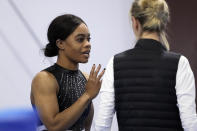 Gabby Douglas, left, talks with Anna Kotchneva after competing at the American Classic Saturday, April 27, 2024, in Katy, Texas. (AP Photo/David J. Phillip)
