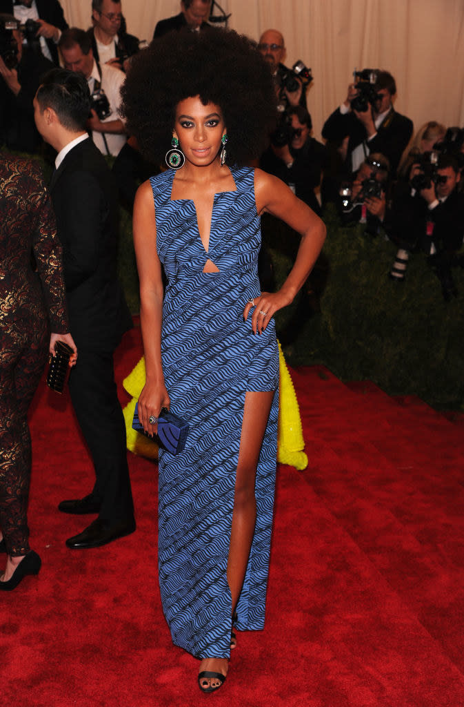 Solange in a blue dress with black swirls