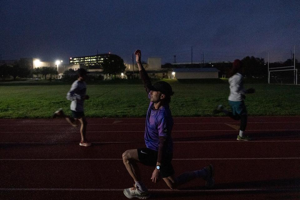 Mitch Ammons trains at Austin High on Tuesday. Ammons, a local runner recovering from drug addiction, joined Gilbert's Gazelles, a local running program coached by nationally renowned Gilbert Tuhabonye.