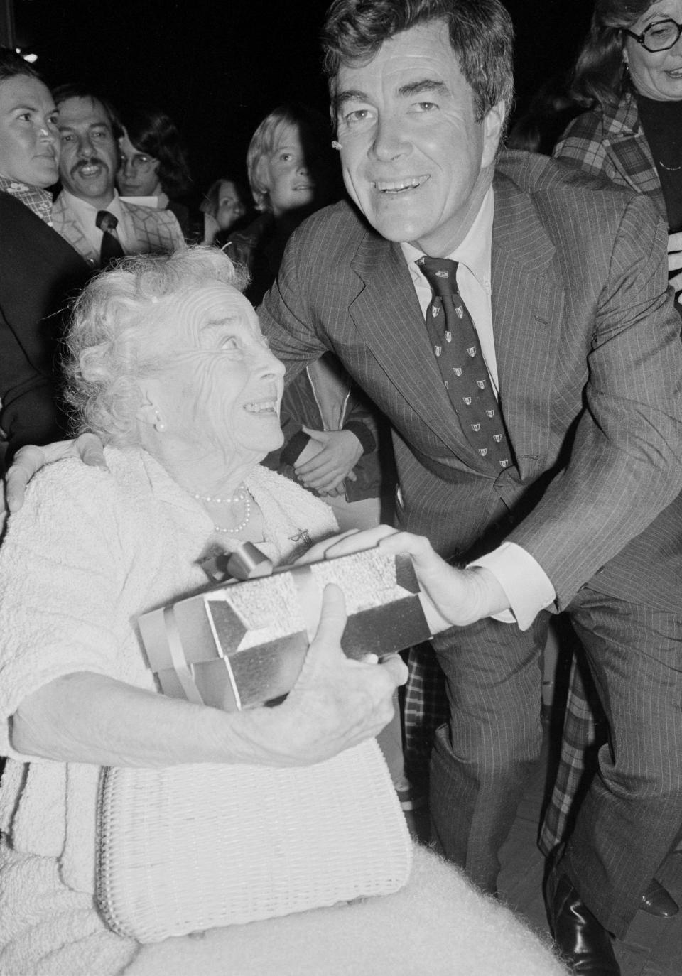 FILE - Representative Paul "Pete" McCloskey, of the 12 Congressional district, presents his mother, Vera, 84, with a corsage at a victory celebration in his honor after he defeated David Harris, a Democrat, Nov. 3, 1976, in Palo Alto, Calif. Former Congressman McCloskey, who ran as a Republican challenging President Richard Nixon in 1972, has died Wednesday, May 8, 2024, at age 96. (AP Photo/John Storey, File)