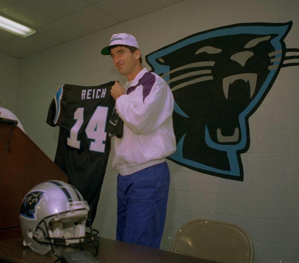 In March 1995, Frank Reich showed off his new No. 14 jersey after signing with the Carolina Panthers.