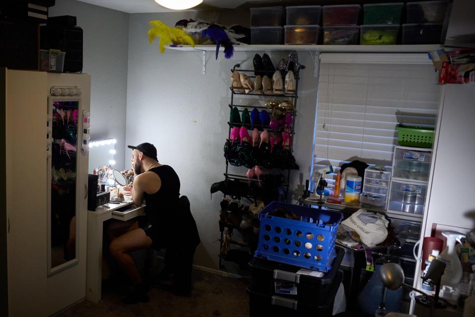 Trey DeGroodt — whose stage name is Trey — puts on makeup in his dressing room while preparing to host Karaoke Night at The Rock in Phoenix on Aug. 29, 2022.