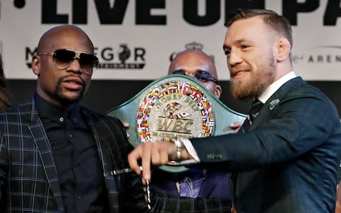 Floyd Mayweather and Conor McGregor - Credit: AP 