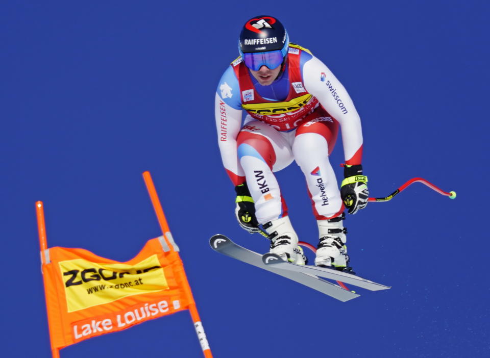 Beat Feuz of Switzerland skis down the course during the men's World Cup downhill ski race in Lake Louise, Alberta, Canada, on Saturday, Nov. 30, 2019. (Frank Gunn/The Canadian Press via AP)