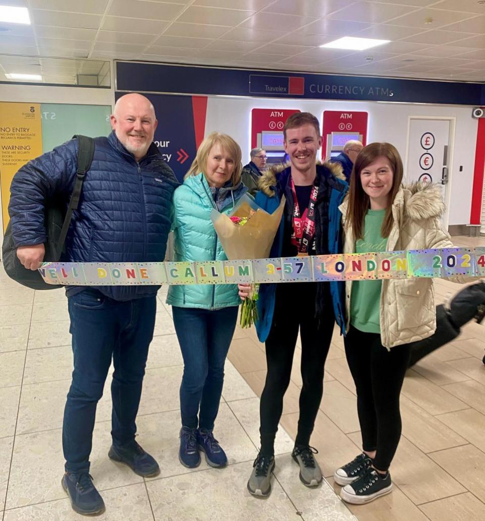 The Herald: Callum Davidson is met by family at Glasgow Airport after the marathon