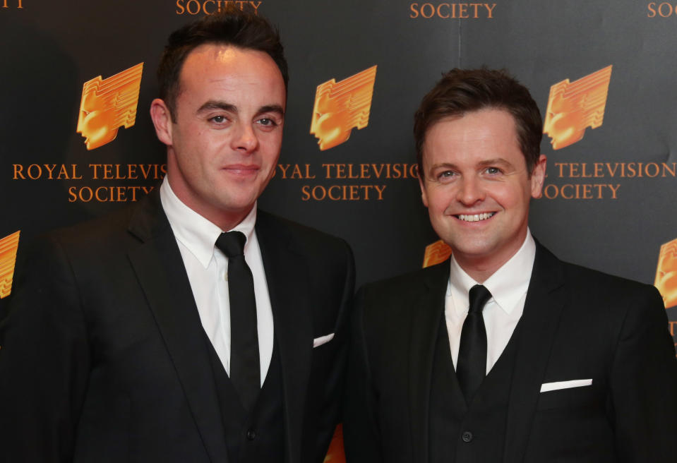 British TV presenters Ant, left and Dec, or Anthony McPartlin and Declan Donnelly, share a joke as they arrive for the Royal Television Society Programme Awards, at Grosvenor House Hotel in central London, Tuesday, March 18, 2014. (Photo by Joel Ryan/Invision/AP Images)