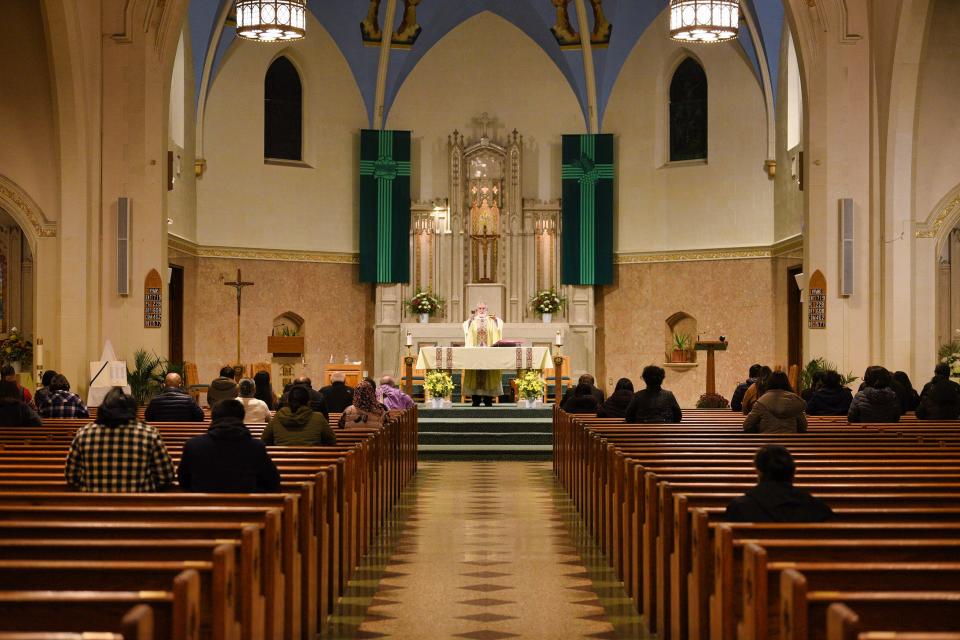 Rev. Msgr. Richard J. Arnhols leads an evening service at St. John the Evangelist in Bergenfield, Monday night on 11/15/21.