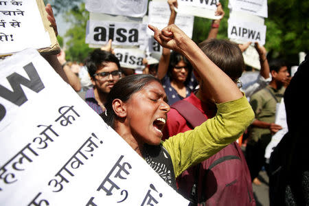 A woman reacts at a protest against the rape of an eight-year old girl, in Kathua, near Jammu and a teenager in Unnao, Uttar Pradesh state, in New Delhi, India April 12, 2018. REUTERS/Cathal McNaughton