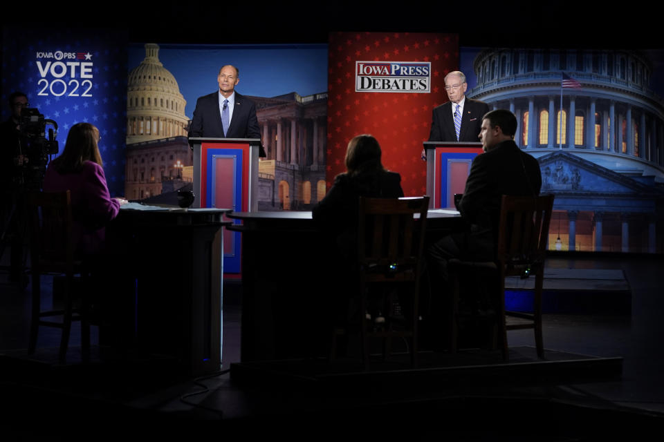 Iowa Democratic U.S. Senate candidate Mike Franken, left, and U.S. Sen. Chuck Grassley, R-Iowa, listen to a question during their debate, Thursday, Oct. 6, 2022, in Des Moines, Iowa. (AP Photo/Charlie Neibergall)