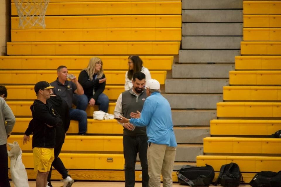 Ohio State football coach Ryan Day was at Bishop Verot Tuesday night to watch Vikings basketball players and Buckeyes signee Leroy Roker play a game.