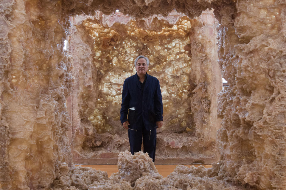 Indian Artist Anish Kapoor stands inside his sculpture '1st Body' in his exhibition 'Kapoor In Berlin' at the Martin-Gropius-Bau museum in Berlin, Friday, May 17, 2013. The exhibition will run from May 18, until Nov. 24, 2013. (AP Photo/Markus Schreiber)