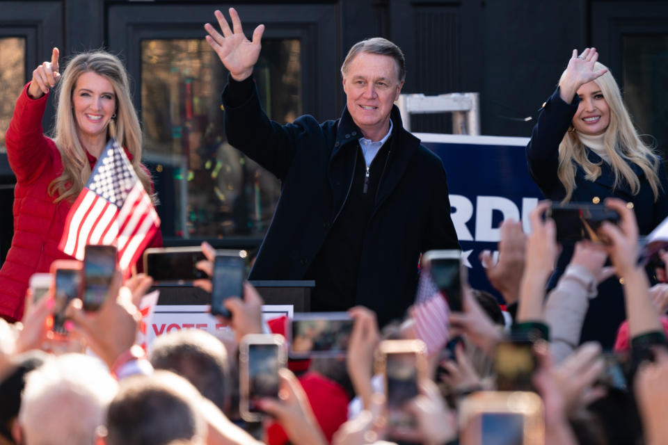 Georgia Sens. Kelly Loeffler (left) and David Perdue (center) campaign with Ivanka Trump on Dec. 21. They have painted the election as a referendum on far-left ideas. (Photo: Elijah Nouvelage/Getty Images)