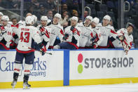 Washington Capitals right wing Tom Wilson (43) celebrates with teammates after scoring against the New York Islanders during the first period of an NHL hockey game, Saturday, Jan. 15, 2022, in Elmont, N.Y. (AP Photo/Mary Altaffer)