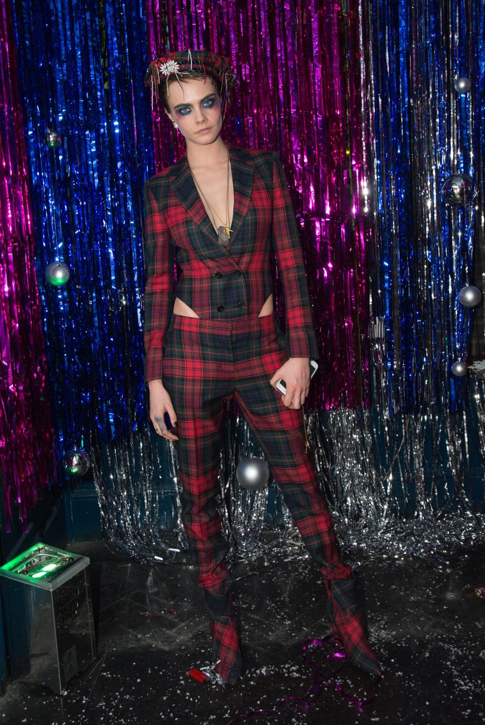 Wearing Burberry to the Burberry x Cara Delevingne party in December 2017