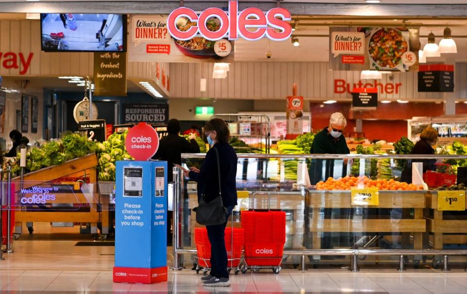 Shoppers walk past at a Coles supermarket in Canberra, Wednesday, August 18, 2021. Source: AAP