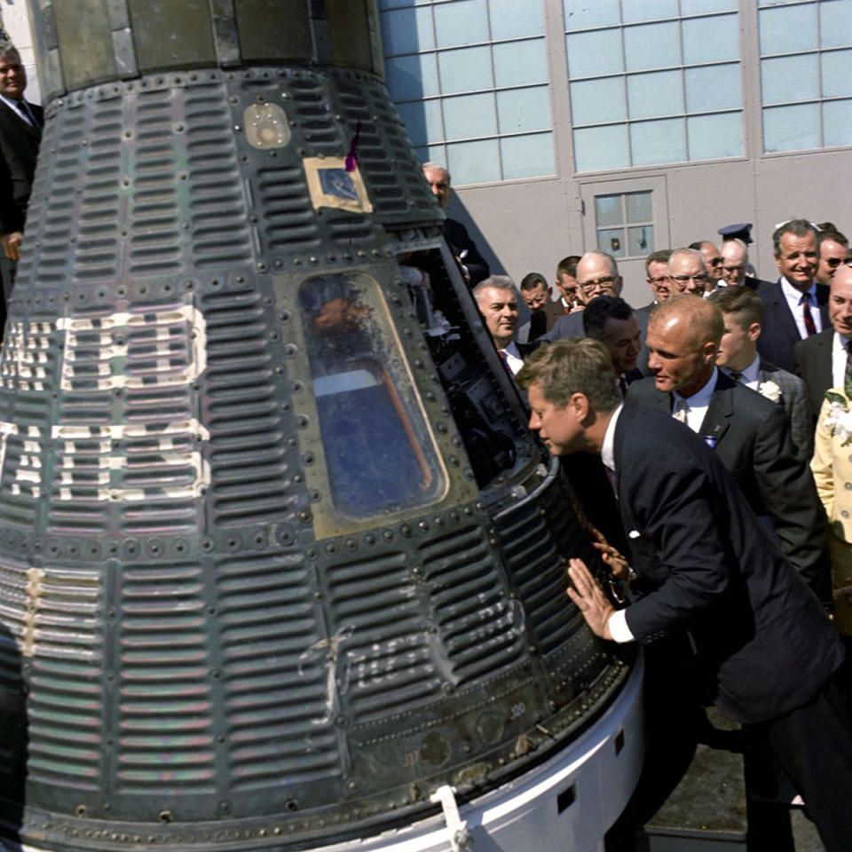 <p>President John F. Kennedy and astronaut John Glenn Jr. look inside space capsule Friendship 7 following the presentation ceremony of the NASA Distinguished Service Medal to Lt. Col. Glenn at Cape Canaveral Air Force Station, Fla., Feb. 23, 1962. The Friendship 7 carried Glenn in orbit around the Earth three times. (Photo: John F. Kennedy Presidential Library and Museum) </p>