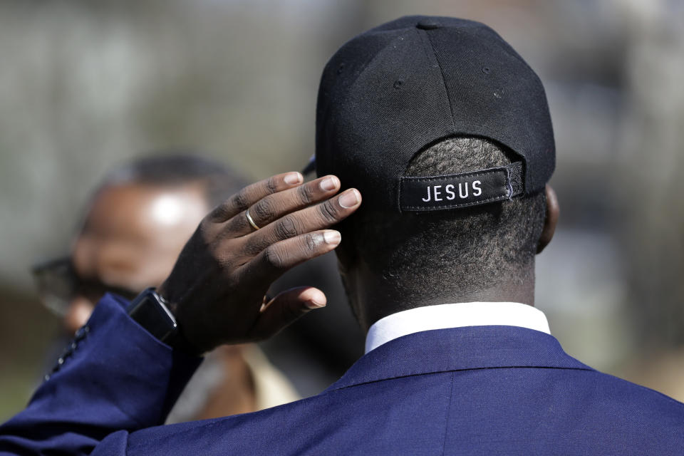 Pastor Jacques Boyd talks with worshippers after a service at Mount Bethel Missionary Baptist Church, Sunday, March 8, 2020, in Nashville, Tenn. The congregation held their service in a tent in the parking lot near the church facilities, which were heavily damaged by a tornado March 3. (AP Photo/Mark Humphrey)