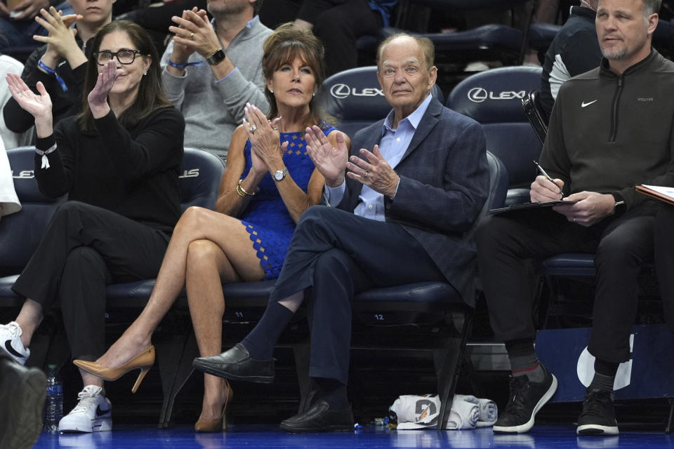 Minnesota Timberwolves majority owner Glen Taylor, center right, applauds while watching play during the second half of the team's NBA basketball game against the Chicago Bulls, Sunday, March 31, 2024, in Minneapolis. (AP Photo/Abbie Parr)