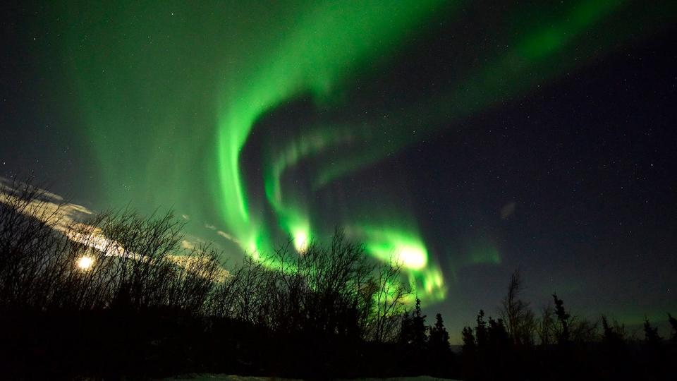 <div>File: The Aurora Borealis appears in the sky on January 8, 2017 near Ester Dome mountain about 10 miles west of Fairbanks, Alaska. The Aurora Borealis is a result of the interaction between solar wind and the earths magnetosphere. (Photo by Lance King/Getty Images)</div>