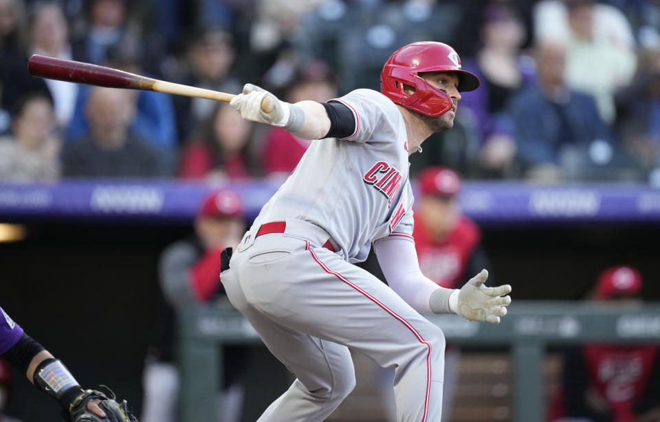 Cincinnati Reds' Tyler Naquin grounds out against Colorado Rockies starting pitcher Chad Kuhl in the third inning of a baseball game Saturday, April 30, 2022, in Denver. (AP Photo/David Zalubowski)