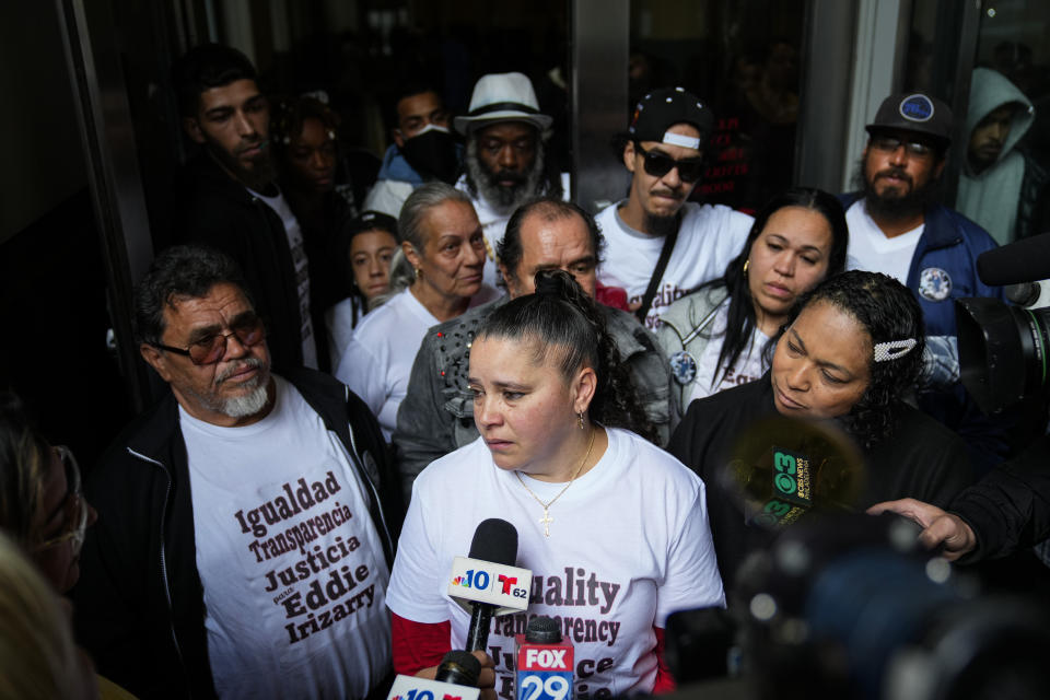 Eddie Irizarry's aunt Ana Cintron, center, speaks with members of the media after a judge has reinstated all charges, including a murder count, against former police officer Mark Dial, in Philadelphia, Wednesday, Oct. 25, 2023. Dial on Aug. 14, shot and killed Irizarry during a during a traffic stop. (AP Photo/Matt Rourke)