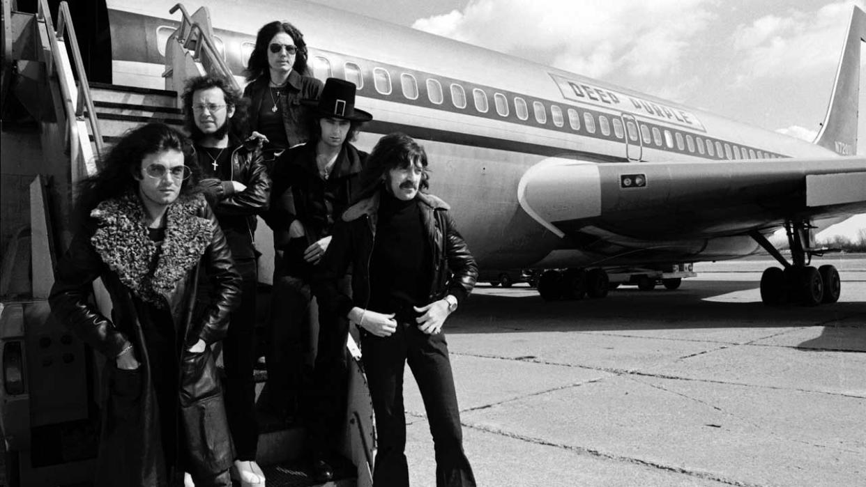  Deep Purple standing next to their Starship Jet plane on the 1974 US tour. 