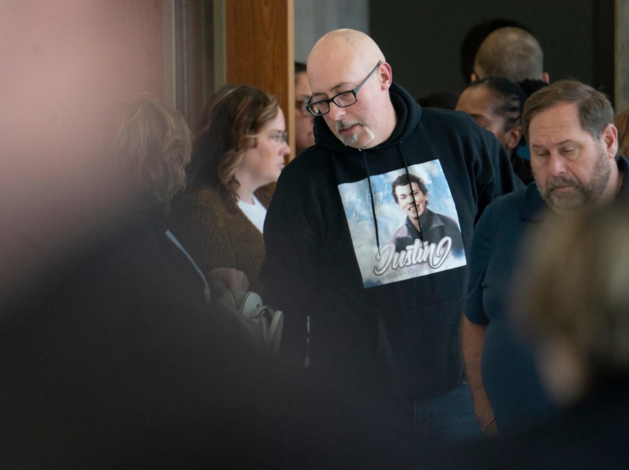 Craig Shilling, father of the late Justin Shilling, who was killed in the Oxford High School shooting in 2021, takes a break in the hallway outside of the courtroom of Judge Kwame Rowe as Ethan Crumbley, the shooter, is set to be sentenced at the Oakland County Courthouse Friday, Dec. 08, 2023.
