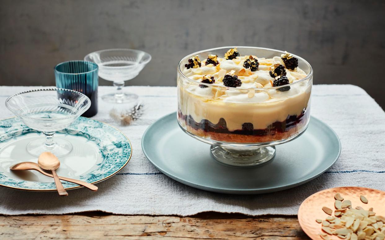 A boozy cream trifle topped with tart blackberries and honey - Laura Edwards
