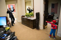 <p>“The President to be caught in Spider-Man’s web as he greets the Nicholas Tamarin, 3, just outside the Oval Office on October 26, 2012. Spider-Man had been trick-or-treating for an early Halloween with his father, White House aide Nate Tamarin in the Eisenhower Executive Office Building. I can never commit to calling any picture my favorite, but the President told me that this was HIS favorite picture of the year when he saw it hanging in the West Wing a couple of weeks later.” (Pete Souza/The White House) </p>