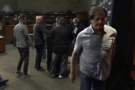 Chicago White Sox manager Tony La Russa, right, leaves a news conference after announcing his retirement from the team due to medical reason before a baseball game between the White Sox and the Minnesota Twins, Monday, Oct. 3, 2022, in Chicago. (AP Photo/Charles Rex Arbogast)