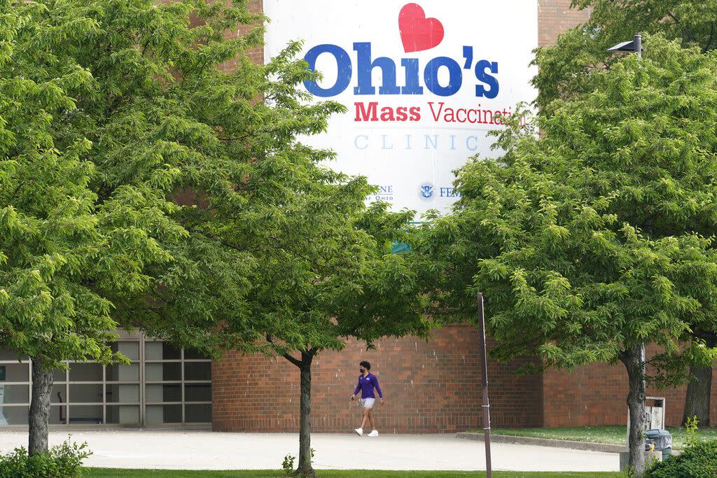 A man walk to the entrance for Ohio's COVID-19 mass vaccination clinic at Cleveland State University on Tuesday.