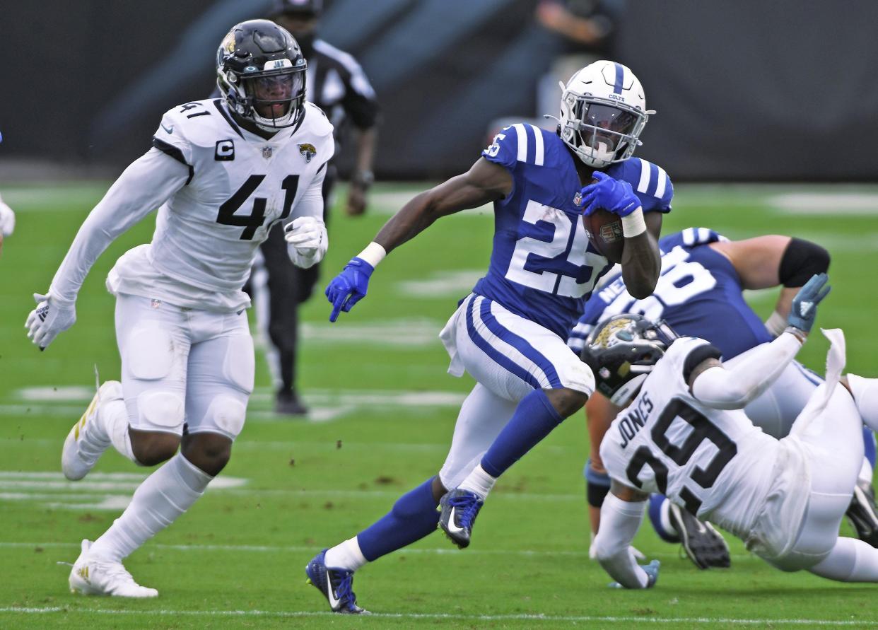 Jacksonville Jaguars defensive end Josh Allen (41) tries to chase down Indianapolis Colts running back Marlon Mack (25) as he scrambles for yardage first quarter pass play. The half ended with the Colts with a 17 to 14 lead over the Jaguars. The Jacksonville Jaguars hosted the Indianapolis Colts for the season opening game at TIAA Bank Field Sunday, September 13, 2020. [Bob Self/Florida Times-Union]