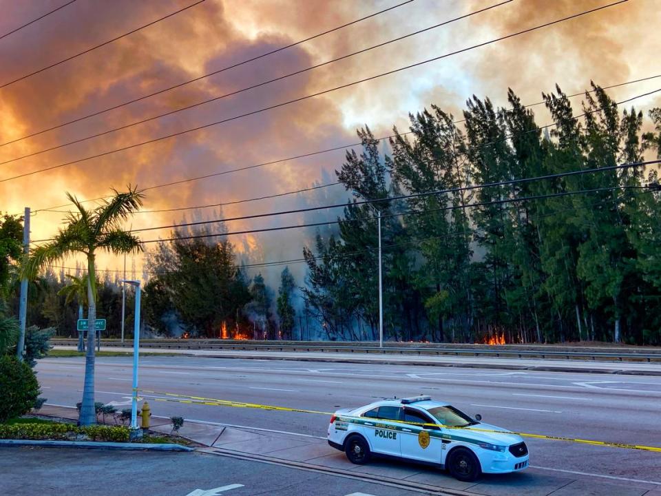 Police shut down SW 8th Street in both directions due to heavy smoke cause by a grass fire at SW 137 Avenue & SW 8 Avenue in Miami, on Sunday, April 14, 2024.