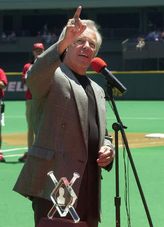 Cincinnati Reds broadcaster Marty Brennaman points up to his broadcast booth after being honored by the Reds team and fans for his pending induction to the Baseball Hall of Fame on July 23 before the Reds game with the Cleveland Indians' July 8 at Cinergy Field in Cincinnati, Ohio. JPS/RCS